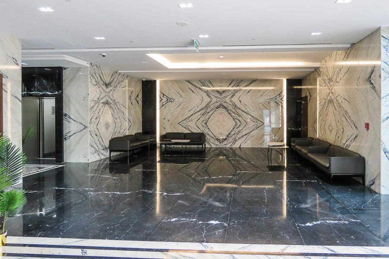 Oyo 860 Studio Apartment, Maya Tower 4, Jumeirah Village Triangle Dubái Exterior foto